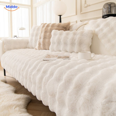 White plush furniture cover with attached cushions for soft, pet-friendly protection.
