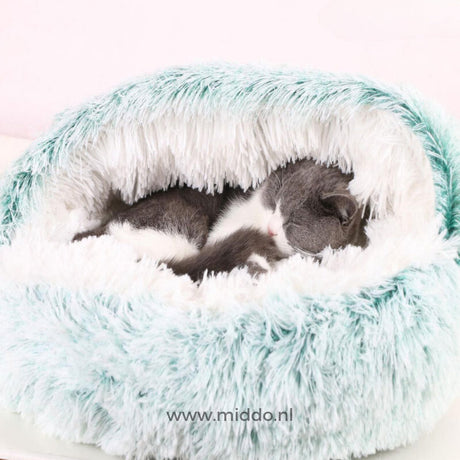 Warm SoftSnuggle pet bed in green color for dogs and cats comfort.