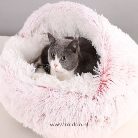 Soft round-shaped SoftSnuggle pet bed in pink for dogs and cats.