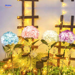 Solar hydrangea LED lantern serving as elegant garden decoration with warm light.