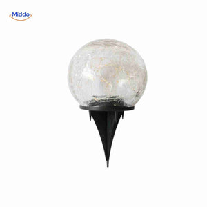 Solvion solar lamp with stake installed on garden pathway.