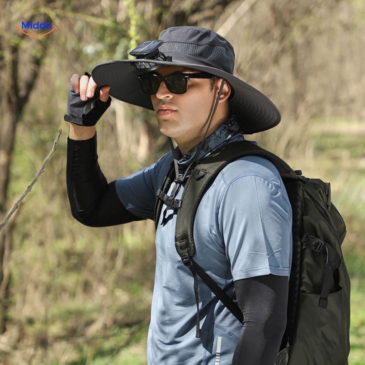 Solar-powered outdoor fan hat with wide brim and built-in ventilation.