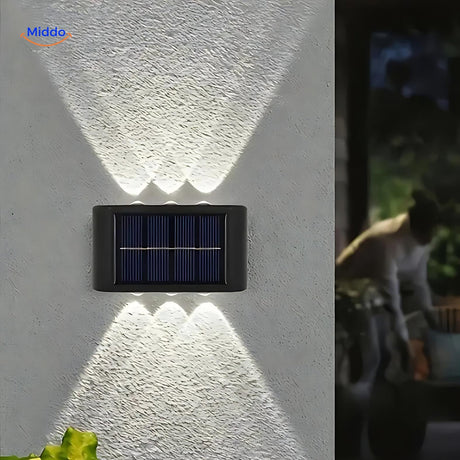 Outdoor solar wall light designed for garden, path, and terrace areas.