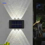 Outdoor solar wall light designed for garden, path, and terrace areas.