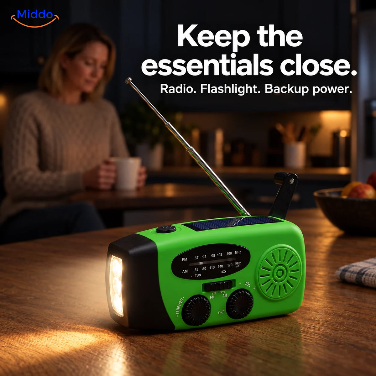 Green SolarPower Pro radio with its flashlight on, sitting on a kitchen counter during a power outage