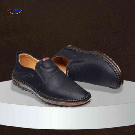 Black Solura loafers blending casual fashion with slip-on comfort.
