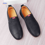Black leather Solura loafers stylish slip-on shoes for men's casual looks.