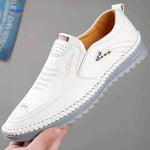 White leather Solura loafers offering slip-on comfort for casual men's style.