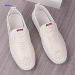 White trendy Solura loafers offering comfortable slip-on style for men.