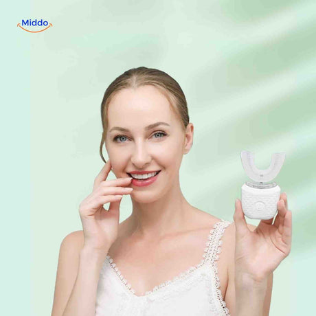 Woman smiling while using U-shaped sonic electric toothbrush with whitening effects.