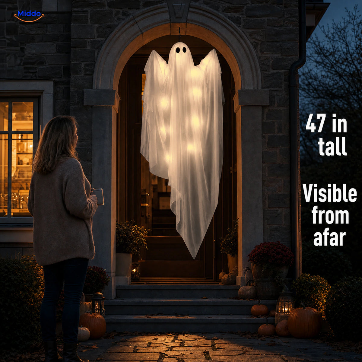 SpookGlow™ Warm White Ghost Lights 47-inch hanging ghost shown at a front entrance