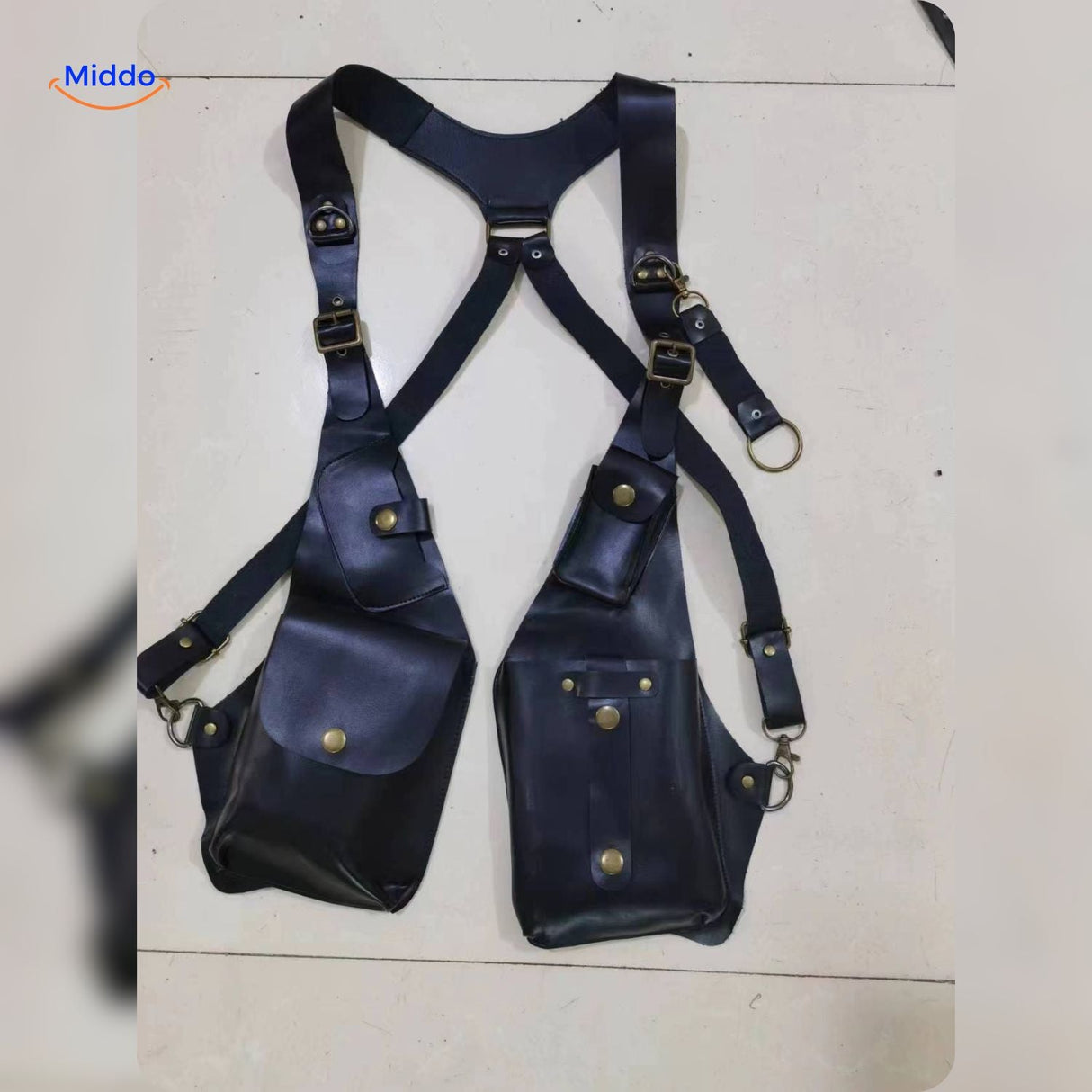 Black leather steampunk shoulder holster bag shown in studio photography.