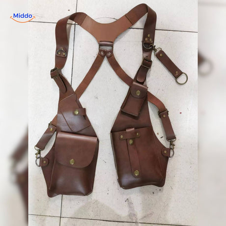 Brown leather steampunk shoulder holster bag displayed in studio lighting.