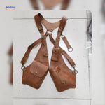Light brown leather steampunk shoulder holster bag in studio setting.