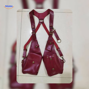 Red leather steampunk shoulder holster bag displayed in studio light.