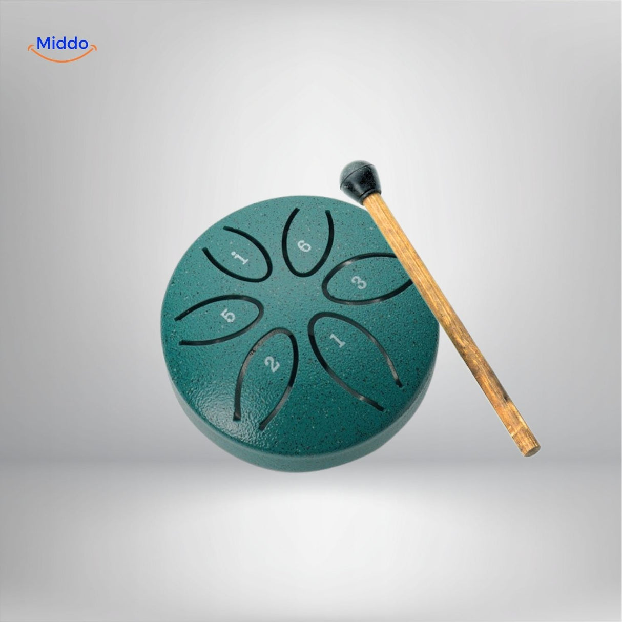 Green steel tongue drum with numbered scale markers and beater.