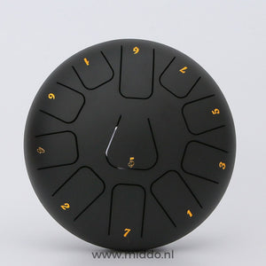 Black 20cm steel tongue drum handpan instrument.