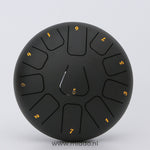 Black 20cm steel tongue drum handpan instrument.