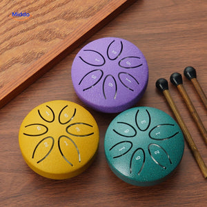 Steel tongue drum collection in green yellow purple for musicians.
