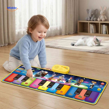 Boy playing on interactive piano dance mat with musical sounds