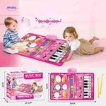 Baby playing on musical mat featuring multiple instrument sounds