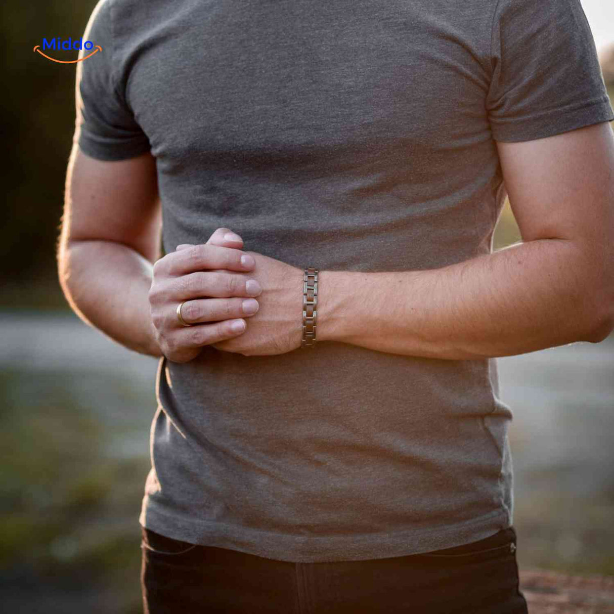 Stylish wooden bracelet for men combining natural wood with metal accents.