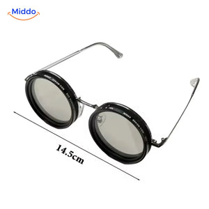 Sunglasses with clear lens and adaptive UV filter technology.