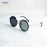 Round sunglasses with elegant golden frame and UV protection coating.