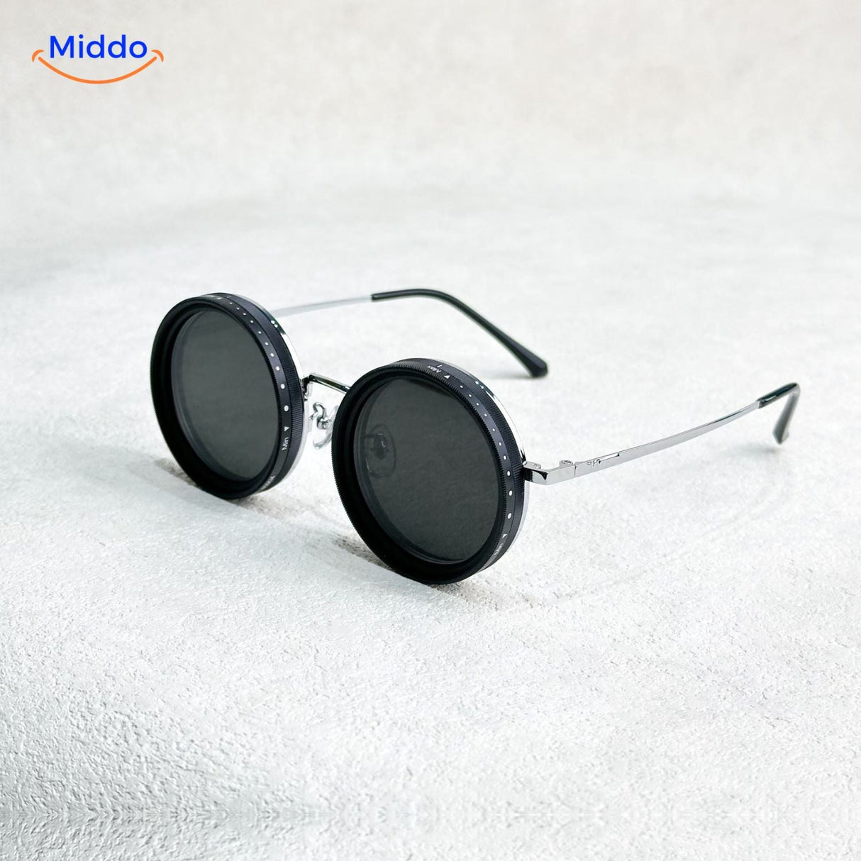 Black round sunglasses with metal frame and UV protection lens technology.