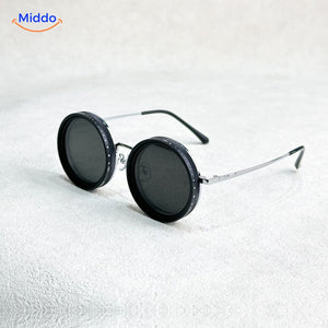 Black round sunglasses with metal frame and UV protection lens technology.