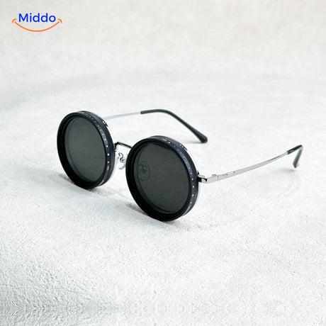Black round sunglasses with metal frame and UV protection lens technology.
