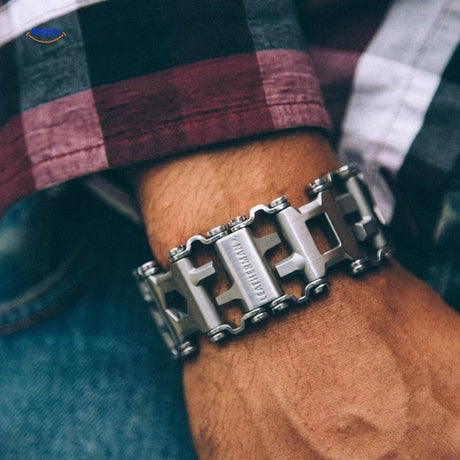 Stainless steel multi-tool bracelet styled on wrist in everyday setting.