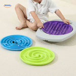 Interchangeable maze discs in purple, green, and blue color options