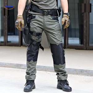 Two-tone tactical pants combining olive green and black colors.