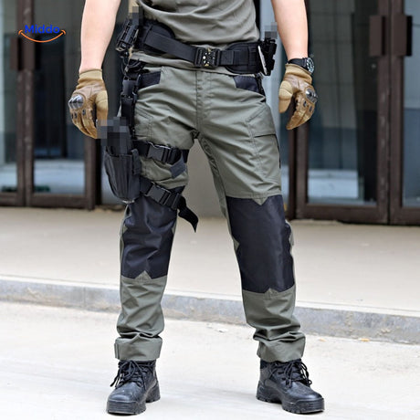 Two-tone tactical pants combining olive green and black colors.