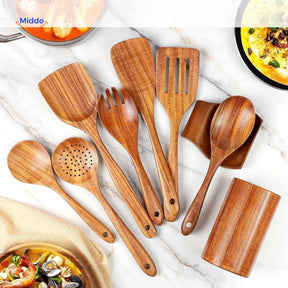 Teak wooden spatula set with natural wood holder containing multiple cooking utensils.