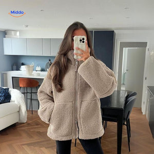 Beige teddy wool coat full length view displaying high collar and silhouette.