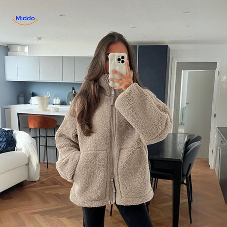 Beige teddy wool coat full length view displaying high collar and silhouette.
