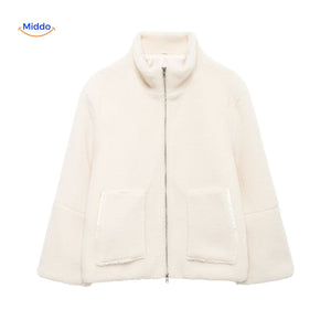 Beige teddy wool coat in studio lighting, showcasing material and color.
