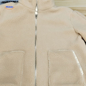 Beige teddy wool coat on white background for clean product presentation.