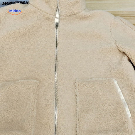Beige teddy wool coat on white background for clean product presentation.