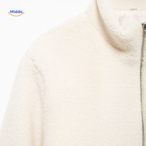 White teddy wool coat chest area closeup displaying collar and upper details.