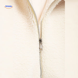 White teddy wool coat fabric detail showing softness and faux lambswool quality.