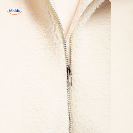 White teddy wool coat fabric detail showing softness and faux lambswool quality.