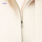 White teddy wool coat fabric detail showing softness and faux lambswool quality.