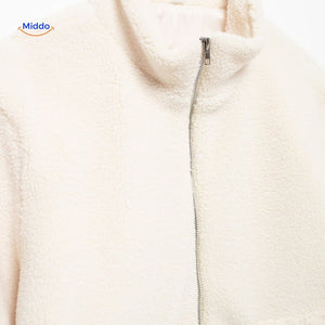 White teddy wool coat front zipper view with high collar design prominent.