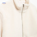 White teddy wool coat front zipper view with high collar design prominent.