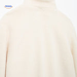 White teddy wool coat rear view showing back panel and overall construction.
