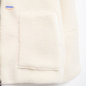 White teddy wool coat upper zipper detail showing collar and neck construction.