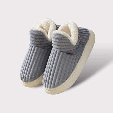 Grey therapeutic fleece winter slippers with white cushioned lining and non-slip sole.